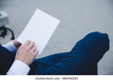 Mock Up Cover Magazine, Catalog, Book. Man Reading A Blank Magazine, Catalog, Book On The Bench.