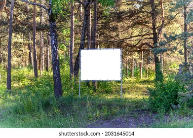 Mock up for design, billboards along the road against the background of the forest. - Shutterstock ID 2031645014