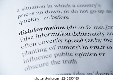 A mock up of a dictionary page with the word Disinformation with selective focussing