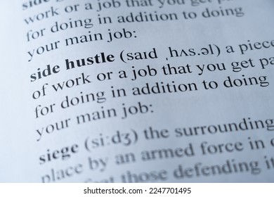 A mock up of a dictionary page with the word side hustle with selective focussing