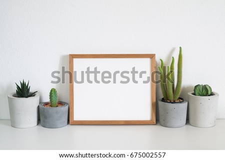 mock up frame with cactus pot.cactus lover