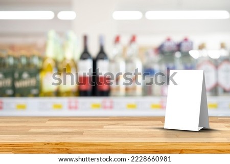 Mock up frame posters pattern template forms background, blank menu frame on table. Alcoholic drinks bottles in assortment shop stand for your text of display your product.
