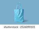 mock up image of a canvas bag, cotton bag or plain blue goodie bag on a light blue background

