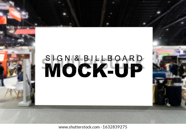 The mock up large horizontal billboard with\
clipping path standing wall at corridor inside hall, blurred people\
walking around, empty space to insert text or media for\
advertisement or\
information