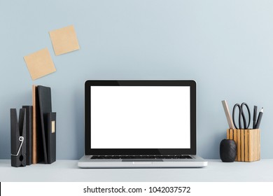 Mock Up Mac Laptop, Sticky Notes And Books On A Desk. Pastel Blue Color

