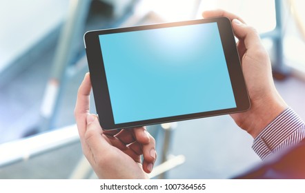 Mock Up Of A Man Holding Digital Tablet Device In Hands. Clipping Path