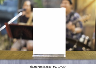 Mock up Menu frame in Bar restaurant ,Stand for booklets with white sheets of paper acrylic tent card on wooden table on - Shutterstock ID 600109754