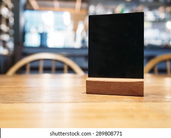 Mock Up Menu Frame On Table In Bar Restaurant Cafe