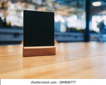 Mock Up Menu Frame On Table In Bar Restaurant Cafe