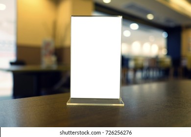 Mock up Menu frame standing on wood table in Bar restaurant cafe. space for text - Shutterstock ID 726256276