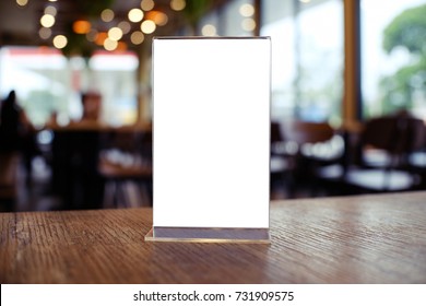 Mock Up Menu Frame Standing On Wood Table In Bar Restaurant Cafe. Space For Text.