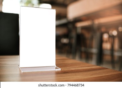 Mock Up Menu Frame Standing On Wood Table In Bar Restaurant Cafe. Space For Text.