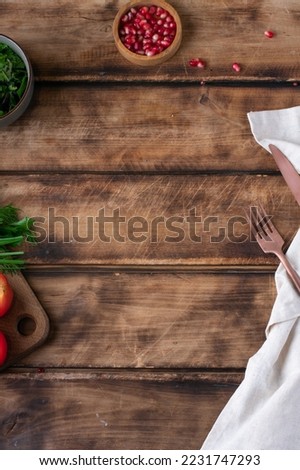 Mock up for menu or recipe. Woodenbackground with wooden plate and linen napkin , fork . top view. copy space