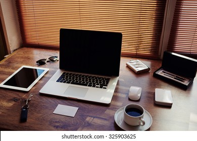 Mock Up Of Modern Desktop With Luxury Accessories And Work Tools, Cup Of American Coffee, Home Keys, Mouse, Envelope, Digital Tablet And Laptop Computer With Blank Copy Space For Text Message 