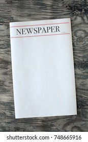 Mock Up Newspaper On Wooden Background