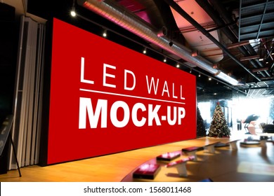 Mock up perspective blank large LED wall on stage in big bike showroom with clipping path, empty space for insert advertising, multi-media for information and promotion event in shopping mall