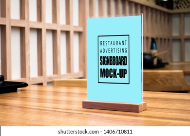 Mock Up Perspective Blank Vertical Advertising Signboard In Acrylic Frame With Clipping Path On Table In Japanese Style Restaurant ,empty Space For Insert Menu List Or Promotion 