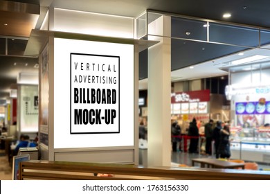 Mock Up Perspective Blank Vertical Signboard With Clipping Path On The Pole At Food Court In Shopping Mall, Empty Space For Insert Advertising Or Announcement Information 