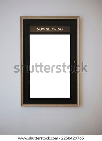 Mock up Poster frame on wall Now showing Movie Poster in theatre