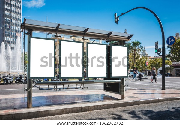 Mock up Poster\
template at Bus station Banners Advertising Media outdoor Sign\
People walking in street city\
