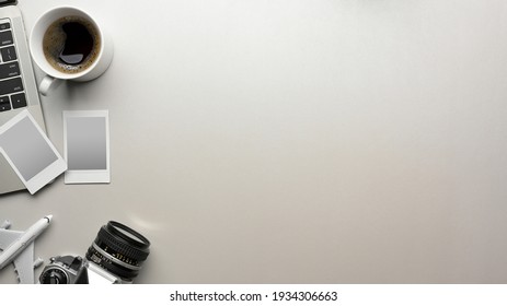 Mock Up Scene Creative Flat Lay In Travel Concept With Travel Items, Camera, Photo Frame, Laptop, Coffee Cup And Copy Space On White Background