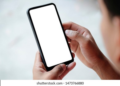 Mock Up Smartphone Of Hand Holding Black Mobile Phone With Blank White Screen