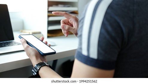 Mock up smartphone of hand holding black mobile phone with blank white screen. - Shutterstock ID 1994251562
