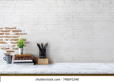 Mock up : Stylish minimalistic white marble table workplace with supplies, house plant. copy space for product display montage.