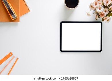 Mock Up Tablet Similar To Ipad White Screen On White Desk Workspace In Office Background.
