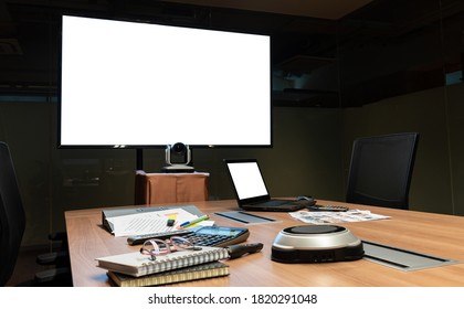 Mock Up Television And Laptop With Clipping Path On Table In Video Conference Meeting Room