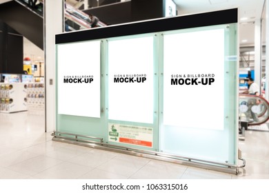 The Mock Up Three Empty Space Of Signboard On Big Stand With Clipping Path At The Airport, White Screen For Signage, Advertising Or Information At Public Transport Near Duty Free Shop