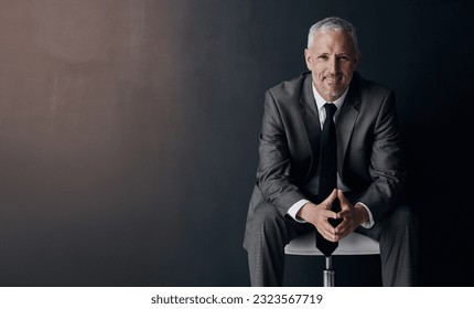 Mock up, chair and happy portrait of lawyer, attorney or businessman with confidence on dark background in studio space. Boss, ceo or business owner with smile, senior executive director at law firm. - Shutterstock ID 2323567719