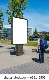 Mock Up. Child Looking At Vertical Blank Billboard Outdoors, Outdoor Advertising, Public Information Board In The Street.