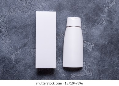 Mock Up, Cream Bottle And Carton Box On Grey Background, Copy Space