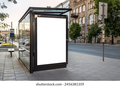 Mock Up Of Vertical Blank White Billboard At A Bus Stop On A City Street. Empty Outdoor Advertising Poster To Display Branding Campaign