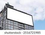 Mock up white LED display billboard on tower building with blue sky background .clipping path for mockup