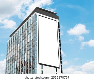 Mock up white vertical large LED display billboard on tower building with blue sky background .Clipping path for mockup