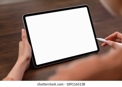 Mock Up Of Woman Hand Holding Digital Tablet And Touching Blank Screen.