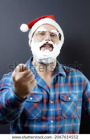 A mocking disguised Santa with a foam beard shows his fig. Figs instead of a gift. Funny christmas poster