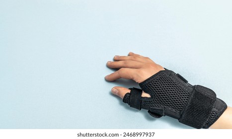 Mockup Adjustable Wristband Arm Support, Thumb Joints And Ligaments, Wrist Brace For Right Or Left Hand. Bandage. Syndrome Tendonitis. Compression, Stabilizer Pain Relief. Blue Background. Horizontal. - Powered by Shutterstock