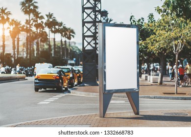 Mockup Of An empty Advertising Poster On The Street Near The Road With Multiple Taxi Cars; Vertical Ad Banner Template In Urban Settings; A Blank Placeholder For Information Billboard On The Sidewalk