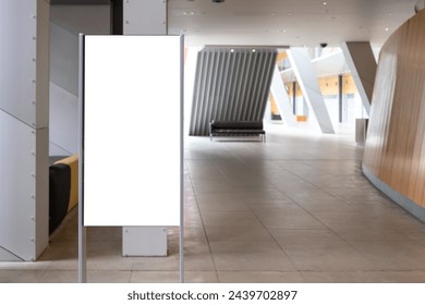 Mockup background of modern Interior with blank advertising display stand. Empty white sign board for showcase information or display direction in an urban hall.