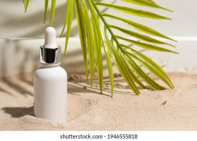 Mockup Of Beauty Fashion Cosmetic Dropper Bottle Lotion Product On Summer Sea Sand Beach With Leaf Palm Coconut Tree