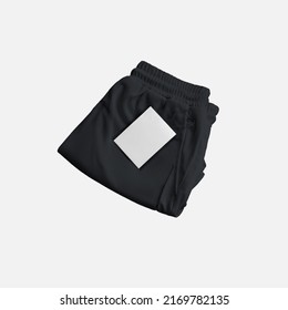 Mockup Of Black Folded Shorts With Compression Lining, Price Tag Near Pocket, Front View. Men's Sportswear Template Isolated On Background