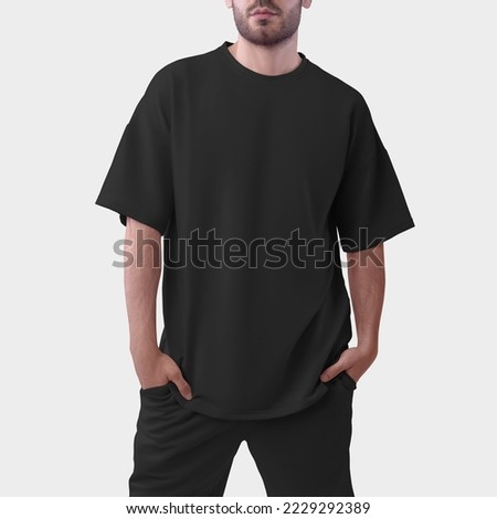 Mockup of an black oversized men's t-shirt for design, print, pattern. Men's clothing template, fashion clothes isolated on background.