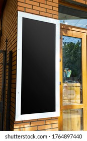 Mockup Black Sign On A Brick Wall Of A Coffee Shop