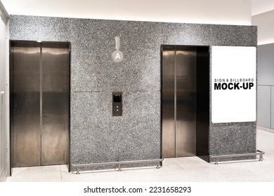 Mockup blank advertising billboard at front of elevator in office building or shopping mall, empty space for insert your text, announcement and advertisement promotion