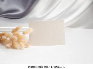 Mockup Blank Card  For Name Place, Folded, Greeting, Invitation With Flower On White Background.