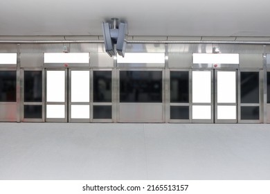 Mockup Of Blank Posters, Banners In Generic Train Station; Advertising Space; OOH Mock Up. Straight Front View Of MRT Platform, Without People.