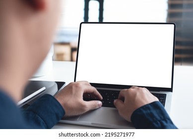 Mockup, blank screen laptop computer. Business man working on laptop computer on table at office. mock up for website design and digital marketing, over shoulder, rear view - Shutterstock ID 2195271977